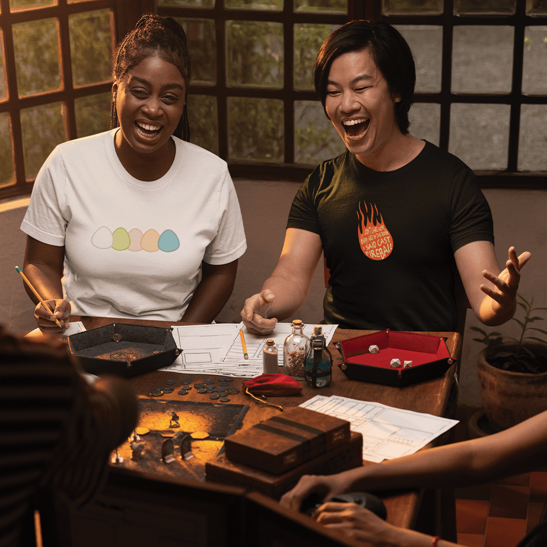 Two people playing D&D wearing Tabletop Tees